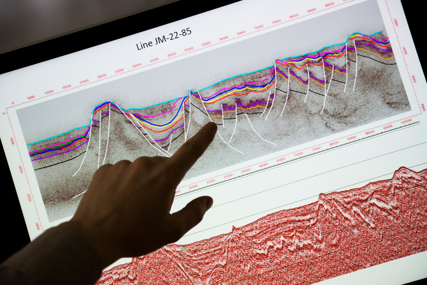 Oceanographer and Hydrocarbon Licensing Manager, shows a map with seismic reflection lines